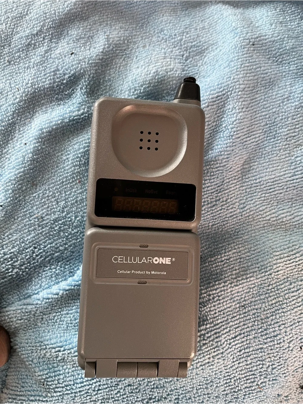 Motorola Silver Flip Phone with Numeric Keypad and Antenna